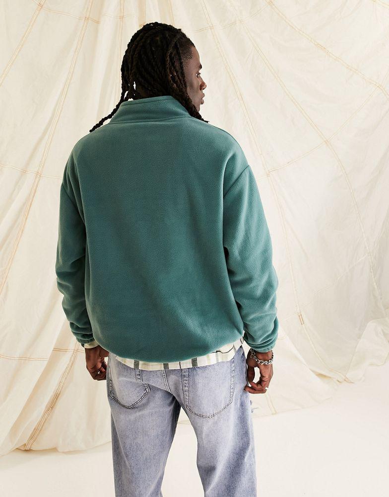 商品ASOS|ASOS Daysocial oversized quarter zip sweatshirt in polar fleece in logo print in teal blue,价格¥268,第6张图片详细描述
