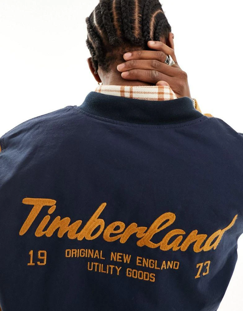 商品Timberland|Timberland utility varsity bomber jacket with back print in navy with contrast sleeves,价格¥1090,第3张图片详细描述
