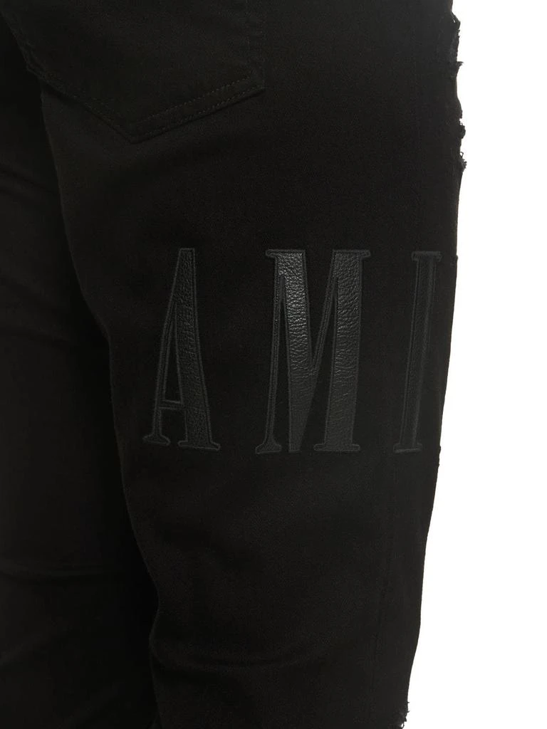 商品AMIRI|Leather Logo Cotton Denim Jeans,价格¥6432,第4张图片详细描述