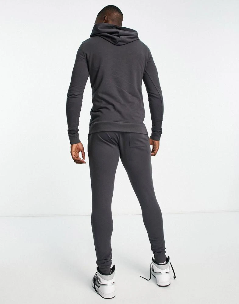 商品ASOS|ASOS DESIGN muscle hoodie with super skinny joggers tracksuit in washed black,价格¥209,第2张图片详细描述