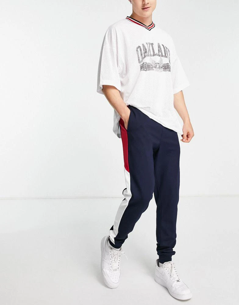 商品Tommy Hilfiger|Tommy Hilfiger Performance colorblock cuffed joggers in navy,价格¥584,第3张图片详细描述