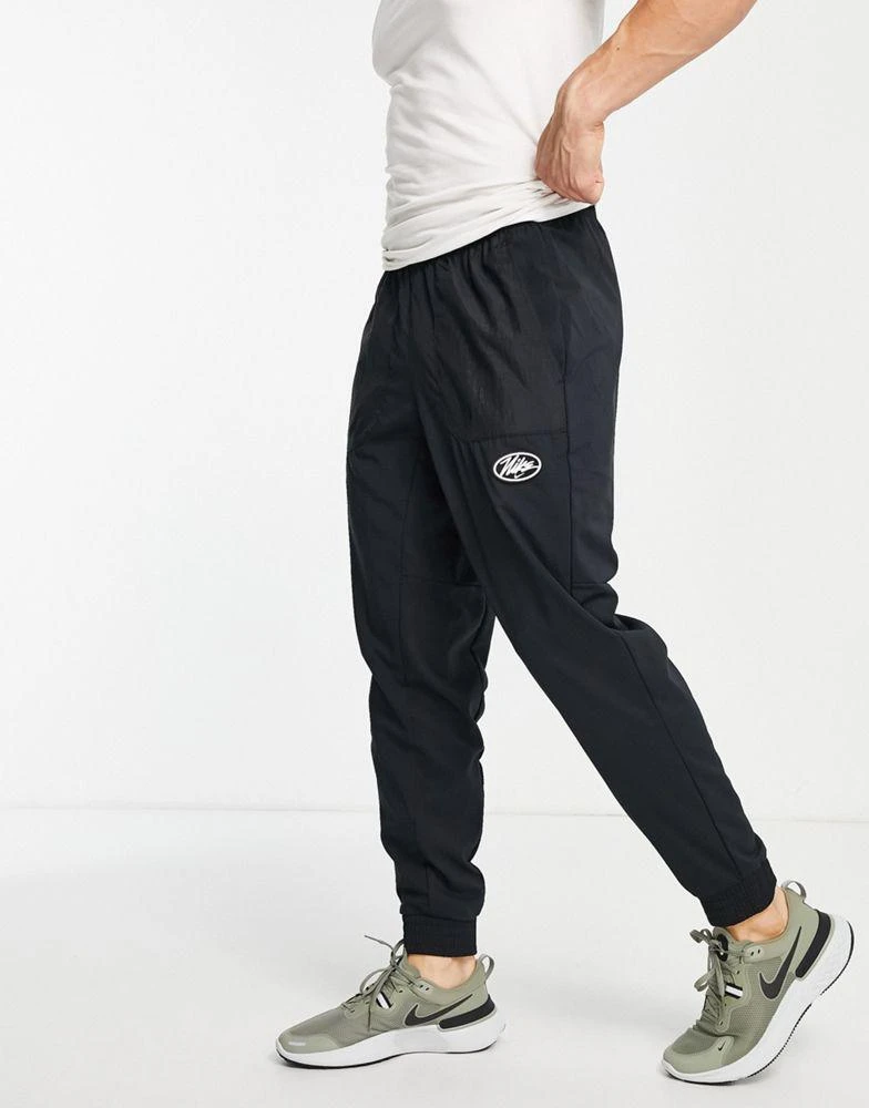 商品NIKE|Nike Training Sport Clash Di-Fit woven joggers in black,价格¥396,第1张图片