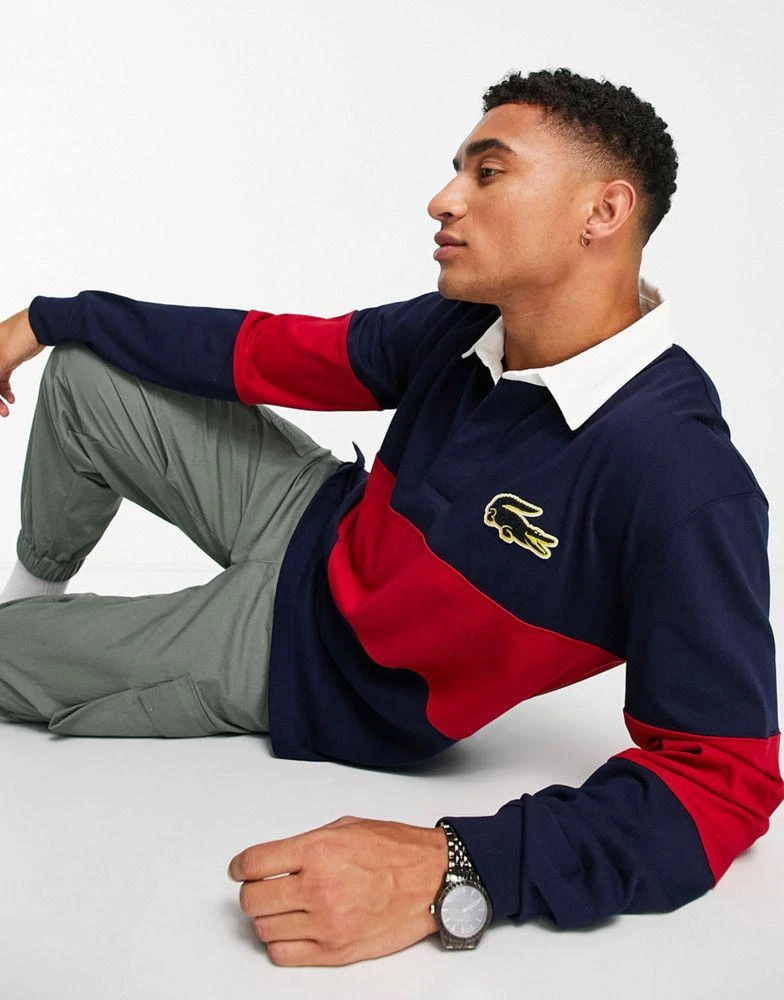 商品Lacoste|Lacoste striped rugby polo in navy/red,价格¥779,第4张图片详细描述