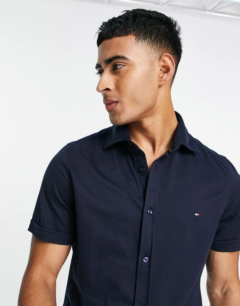 商品Tommy Hilfiger|Tommy Hilfiger 1985 icon logo short sleeve pique shirt slim fit in navy,价格¥700,第3张图片详细描述