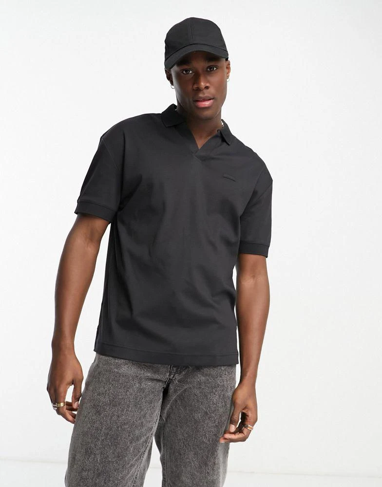 商品Calvin Klein|Calvin Klein open placket polo shirt in black,价格¥725,第1张图片