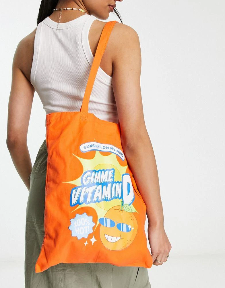 商品Skinnydip|Skinnydip Vitamin D slogan tote bag in orange,价格¥60,第1张图片