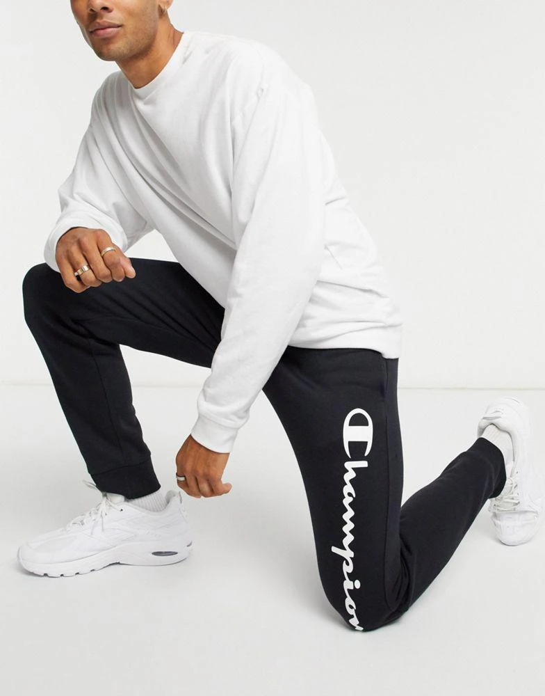 商品CHAMPION|Champion large logo tracksuit bottoms in black,价格¥354,第1张图片