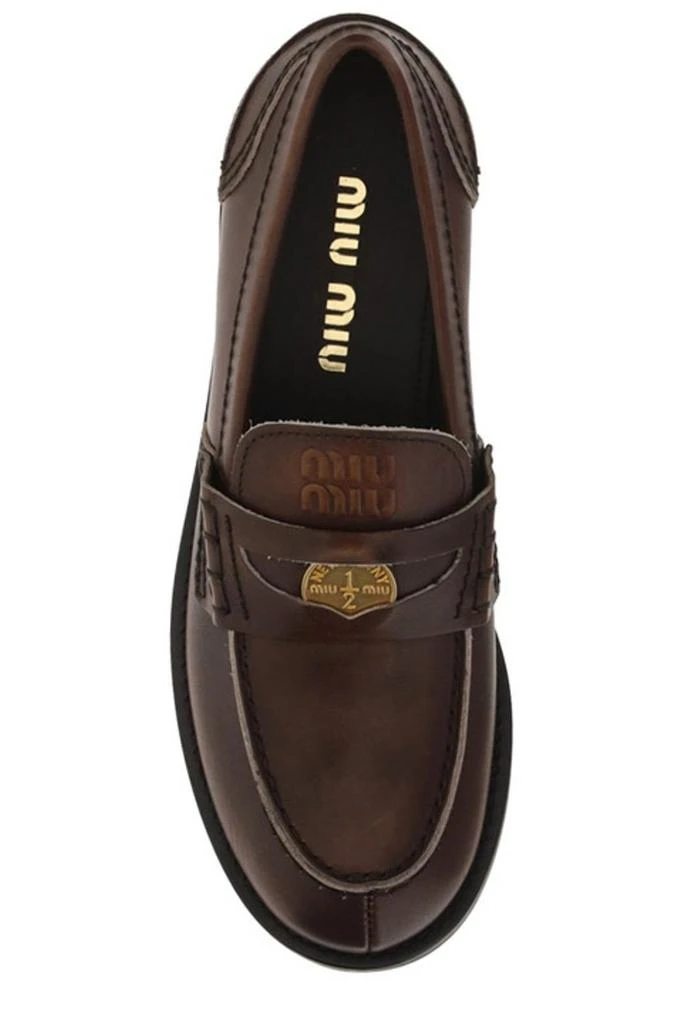 商品Miu Miu|Miu Miu Logo Embossed Slip-On Penny Loafers,价格¥7995,第4张图片详细描述