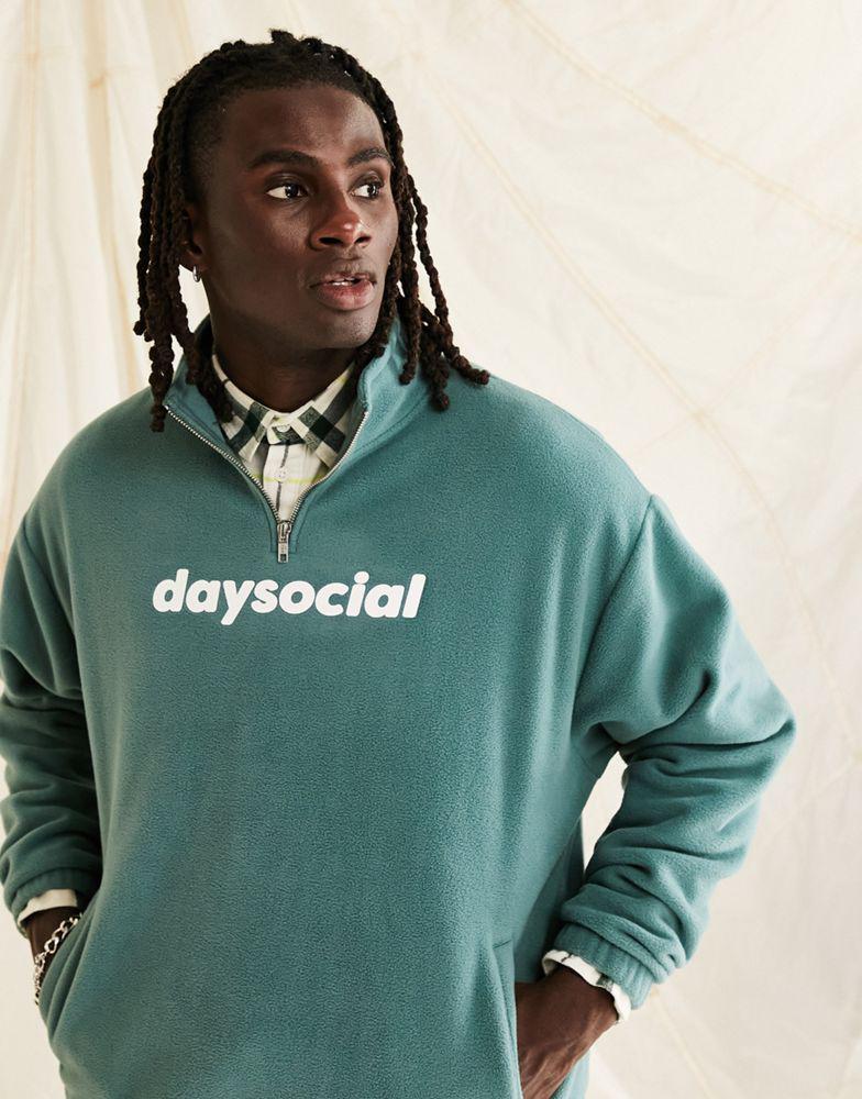 ASOS Daysocial oversized quarter zip sweatshirt in polar fleece in logo print in teal blue商品第1张图片规格展示