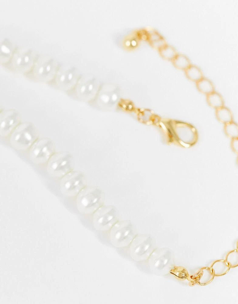 商品ASOS|ASOS DESIGN 14k gold plated necklace with glass pearls and dolphin pendant,价格¥48,第4张图片详细描述