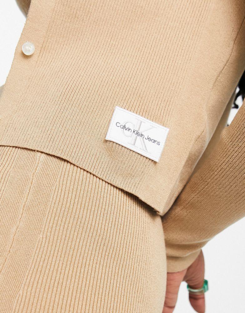 商品Calvin Klein|Calvin Klein Jeans co-ord badge knitted cardigan in camel,价格¥560-¥747,第6张图片详细描述