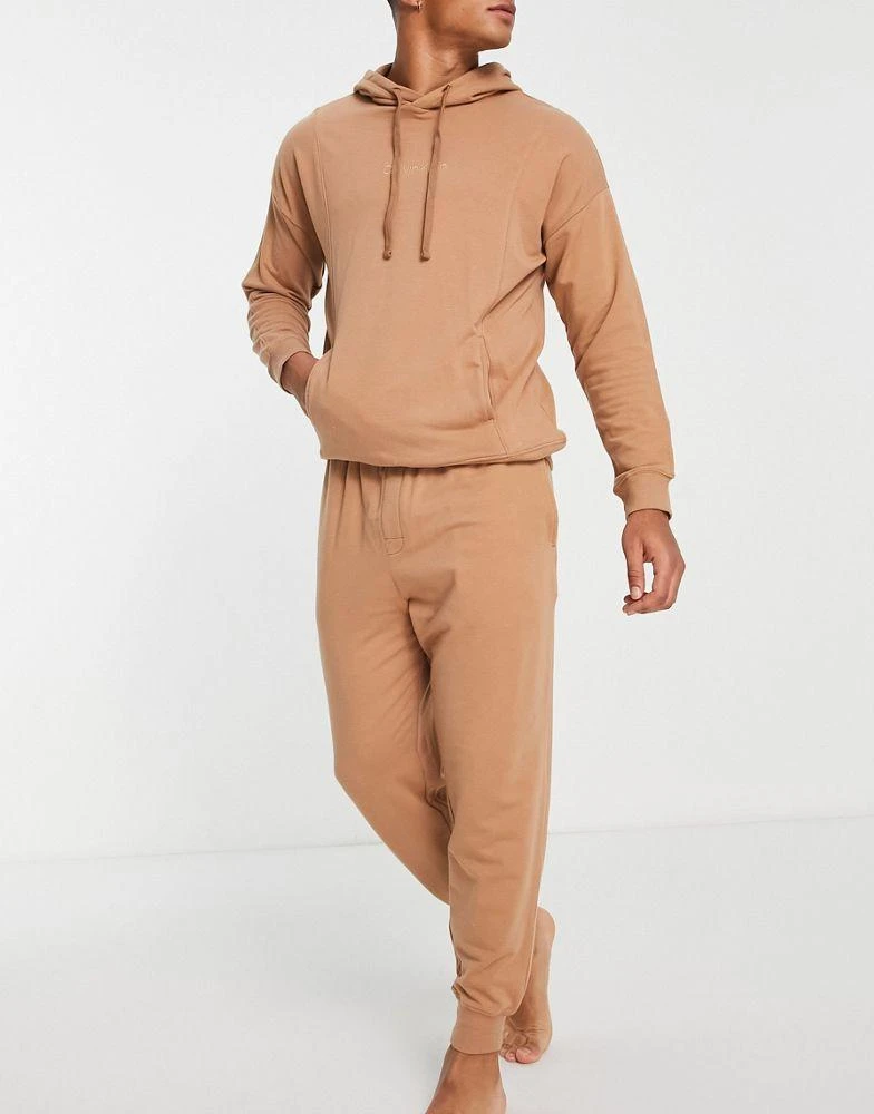 商品Calvin Klein|Calvin Klein contrast waistband lounge joggers in camel co-ord,价格¥441,第1张图片