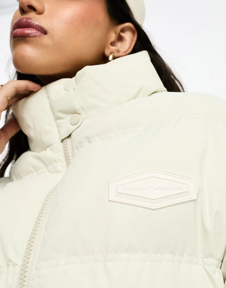 商品The Couture Club|The Couture Club oversized pleated puffer jacket in beige with tie waist detail,价格¥1457,第4张图片详细描述