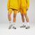 color US21501VGL/VARSITY GOLD, New Balance | Uni-ssentials Cotton Legging Short