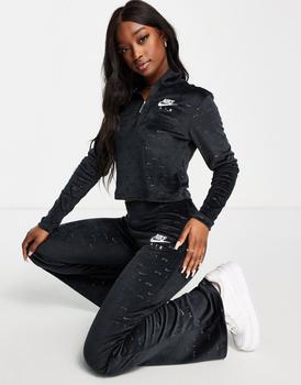 推荐Nike Air velour flare trousers in black with all over swoosh商品