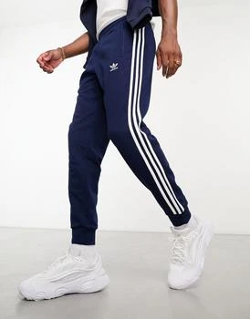 Adidas | adidas Originals adicolor three stripe joggers in navy,商家ASOS,价格¥588