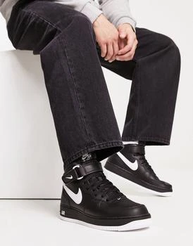 推荐Nike Air Force 1 Mid trainers in black and white商品